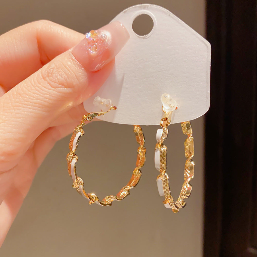 Eaioncol Spliced Twisted Hoop Earrings Gold