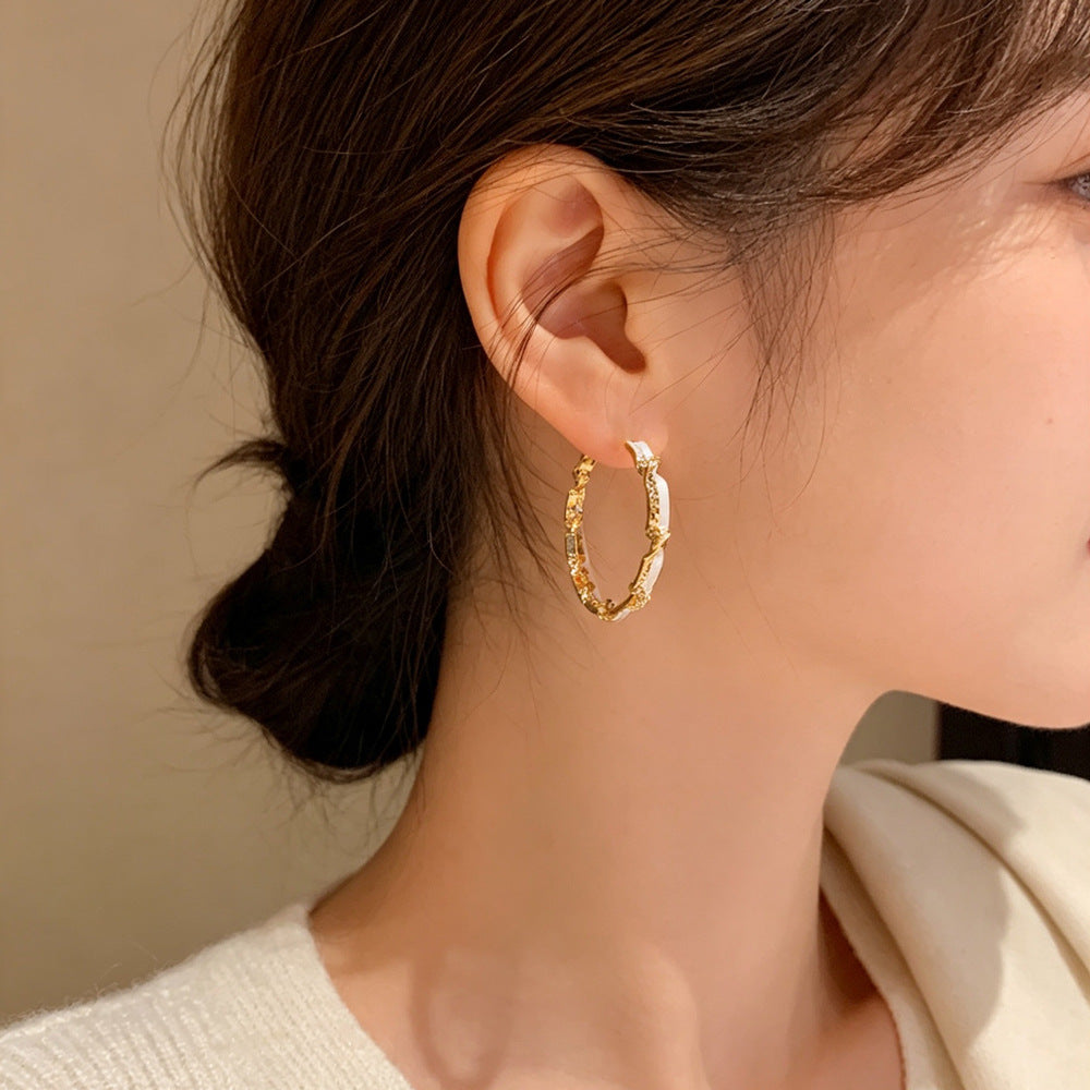 Eaioncol Spliced Twisted Hoop Earrings Gold