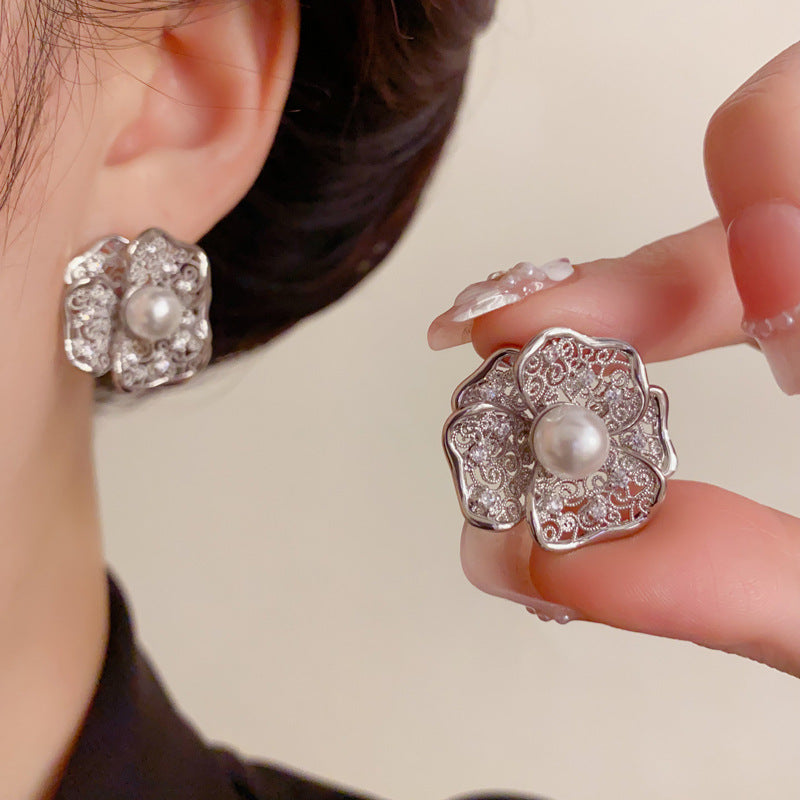 Elegant Hollow Metal Pearl Petal Stud Earrings – Floral Design