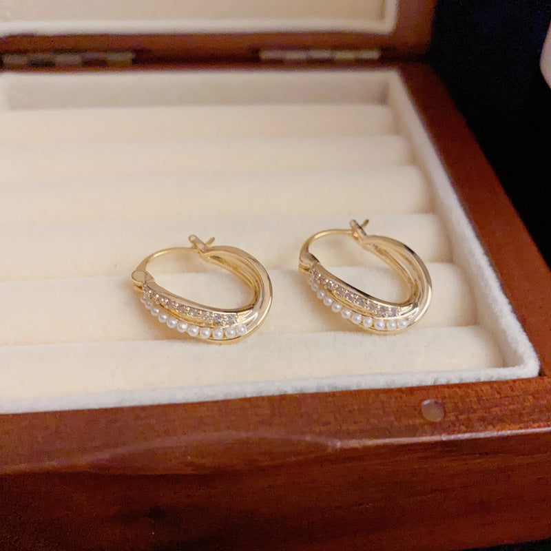 14K Gold Pearl & Rhinestone Crossover Hoop Earrings – Elegant Design