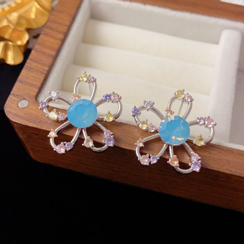 Elegant Rhinestone Hollow Petal Stud Earrings – Floral Design