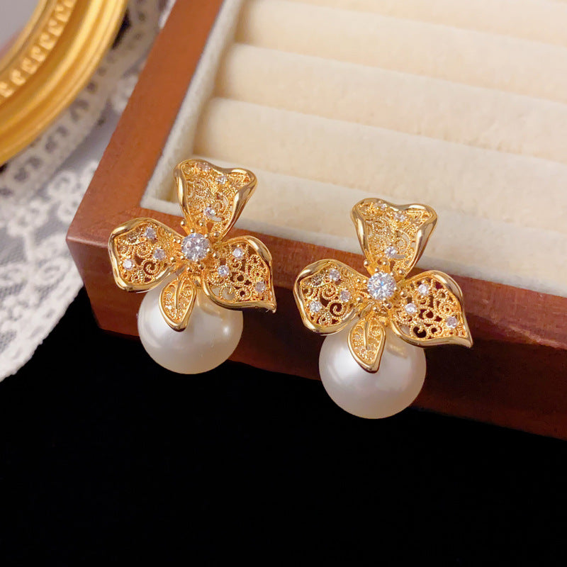 Elegant Hollow Metal Petal Pearl Stud Earrings – Floral Design