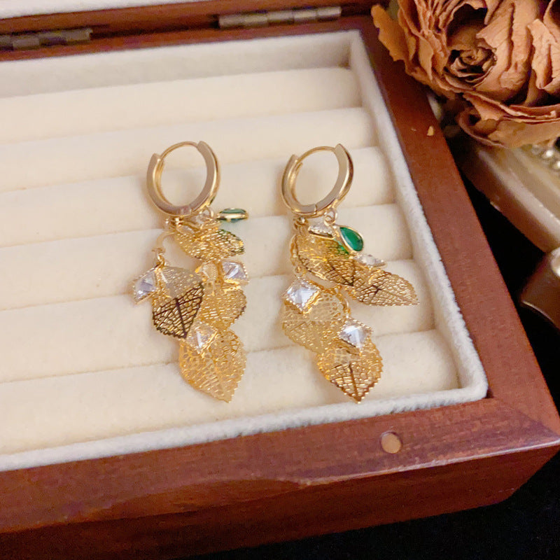 French-Style Hollow Metal Leaf Tassel Earrings – Elegant Floral Design