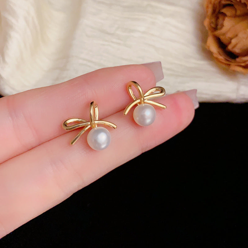Elegant Bow & Freshwater Pearl Stud Earrings – Silver Needle Design