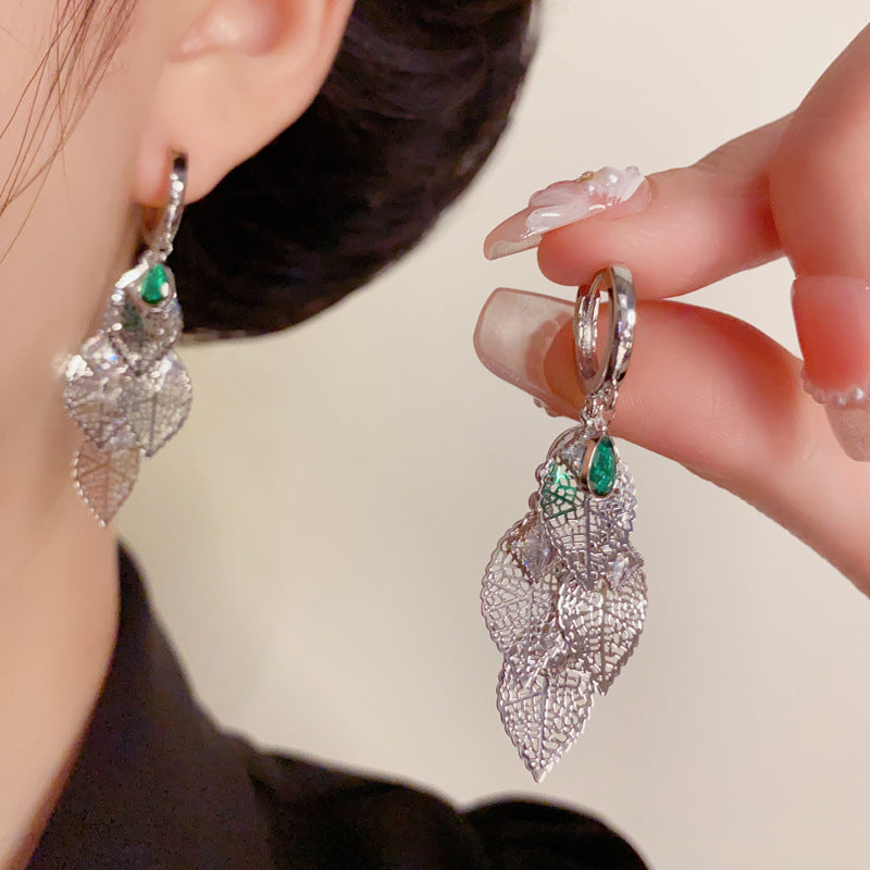 French-Style Hollow Metal Leaf Tassel Earrings – Elegant Floral Design