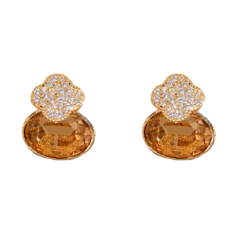 Elegant Four-Leaf Flower Oval Stud Earrings – Floral Geometric Design