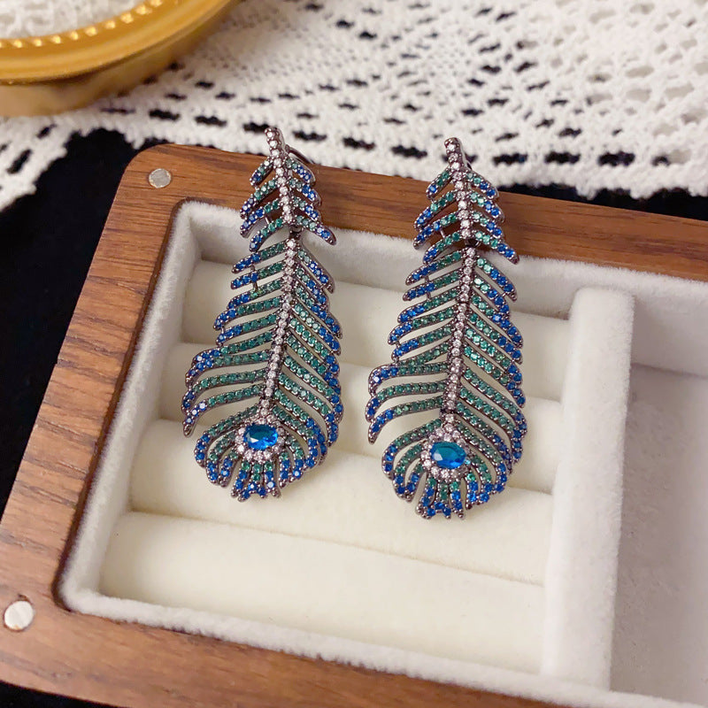 Elegant Peacock Feather Tassel Drop Earrings – Boho Dangle Design