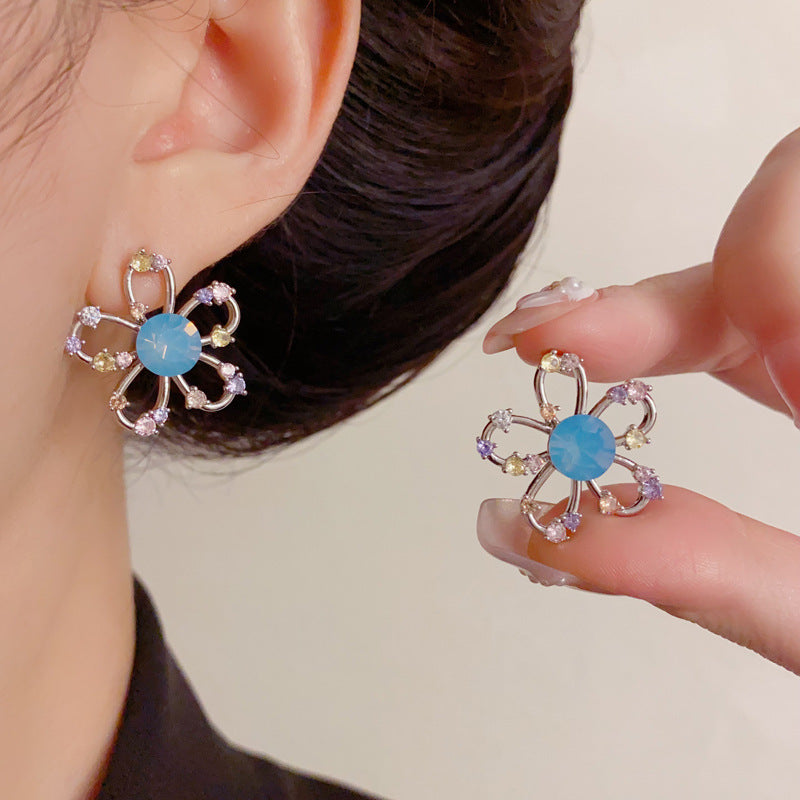 Elegant Rhinestone Hollow Petal Stud Earrings – Floral Design