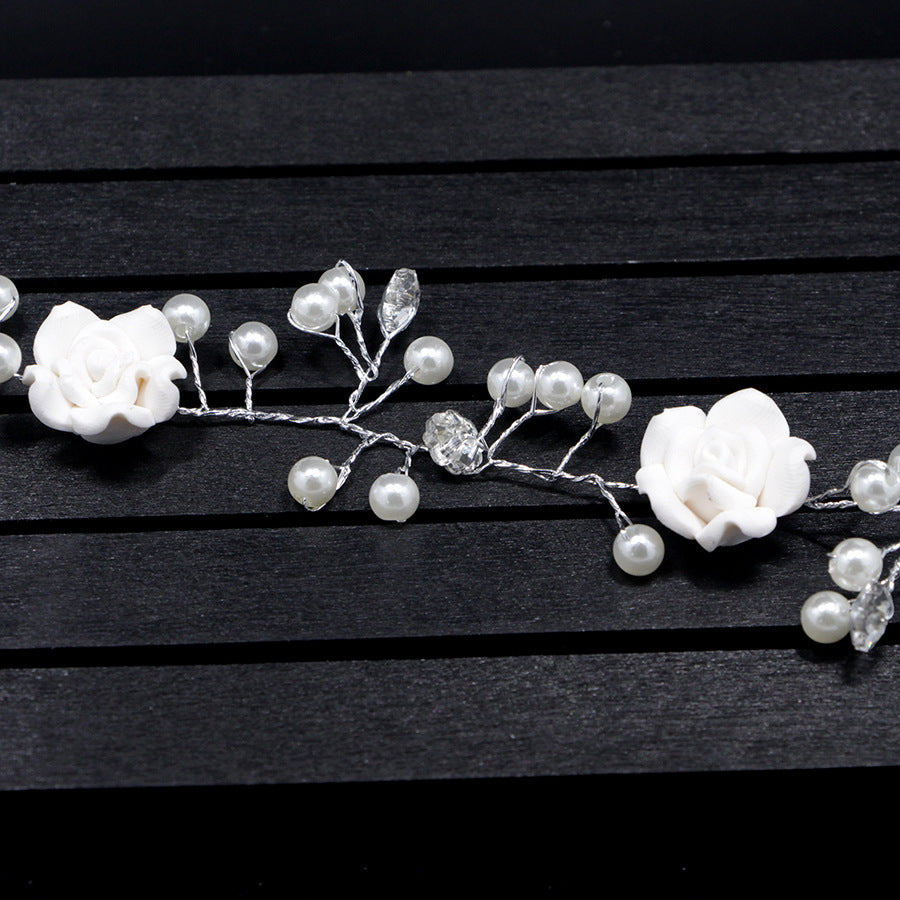 Bride's wedding photo building with makeup handmade pearl white flowers and long soft chain