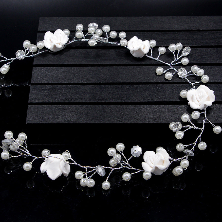 Bride's wedding photo building with makeup handmade pearl white flowers and long soft chain