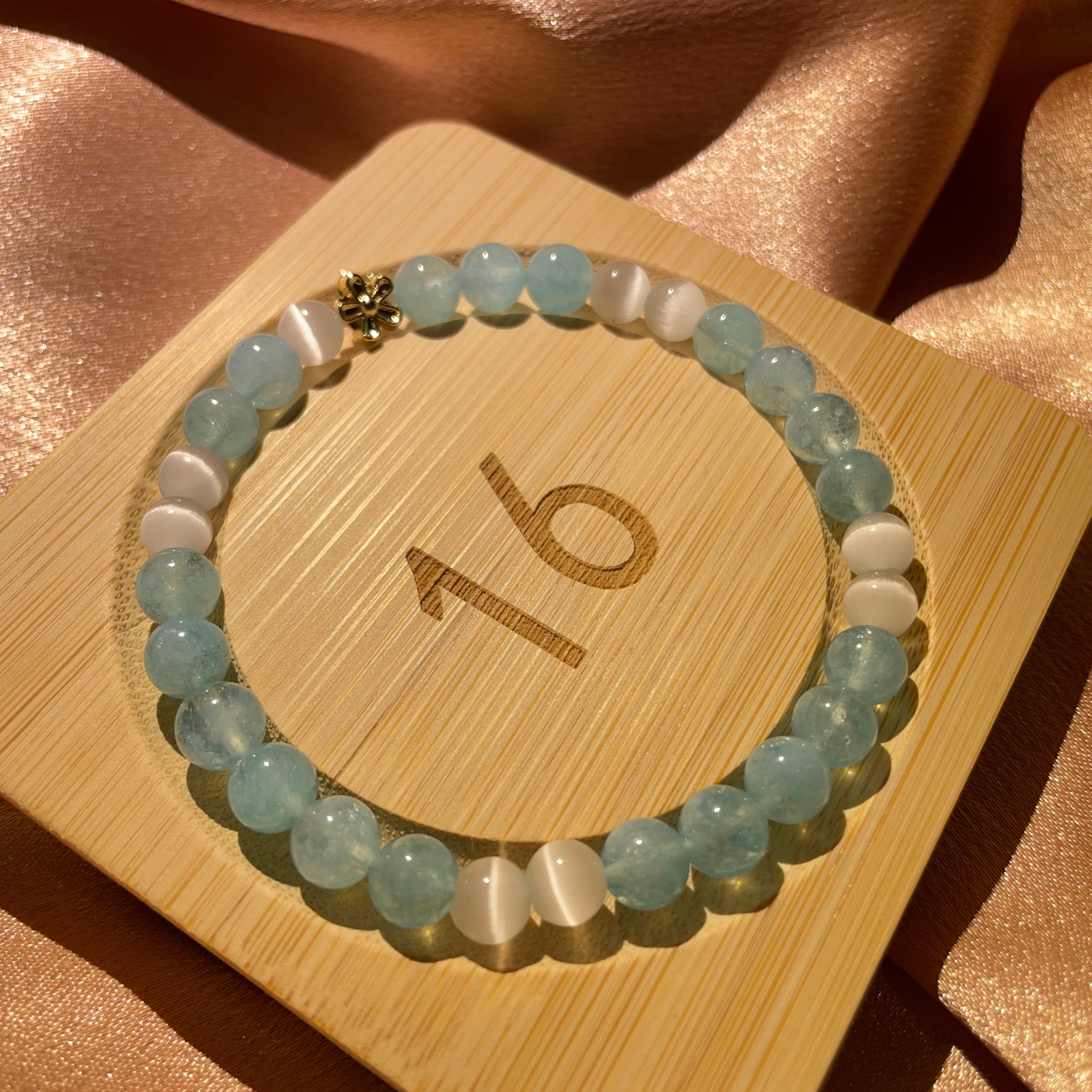 Image of a bracelet with blue and white crystals