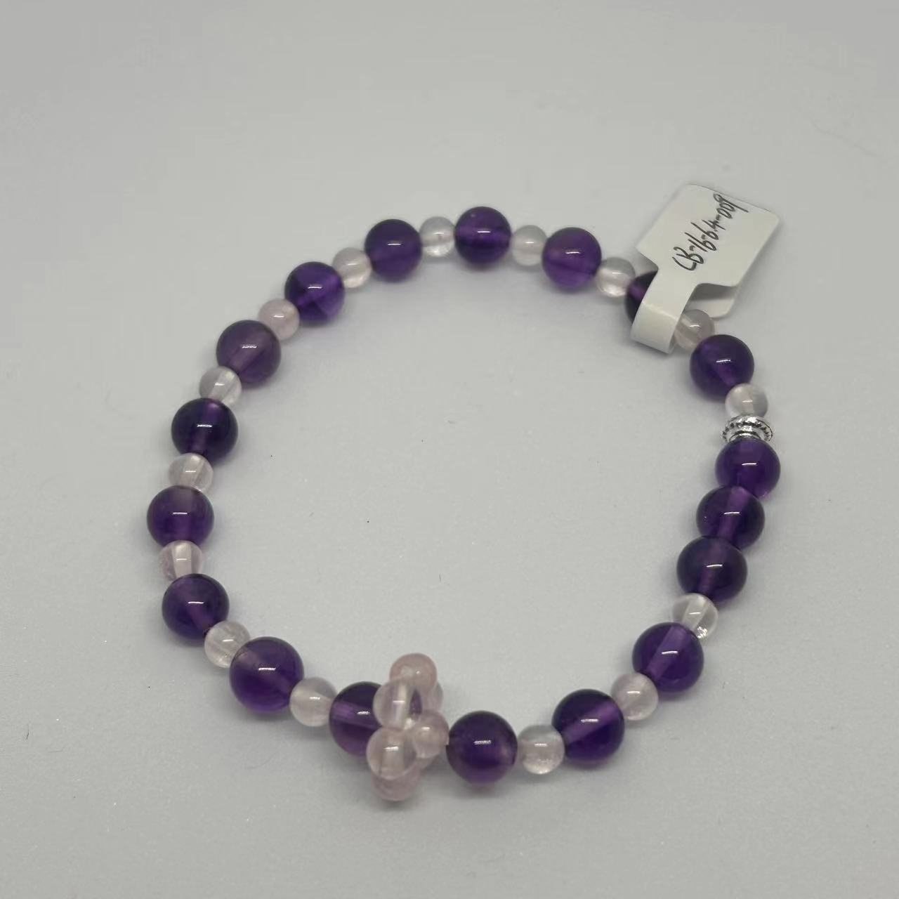 Image of a bracelet with purple and transparent crystals