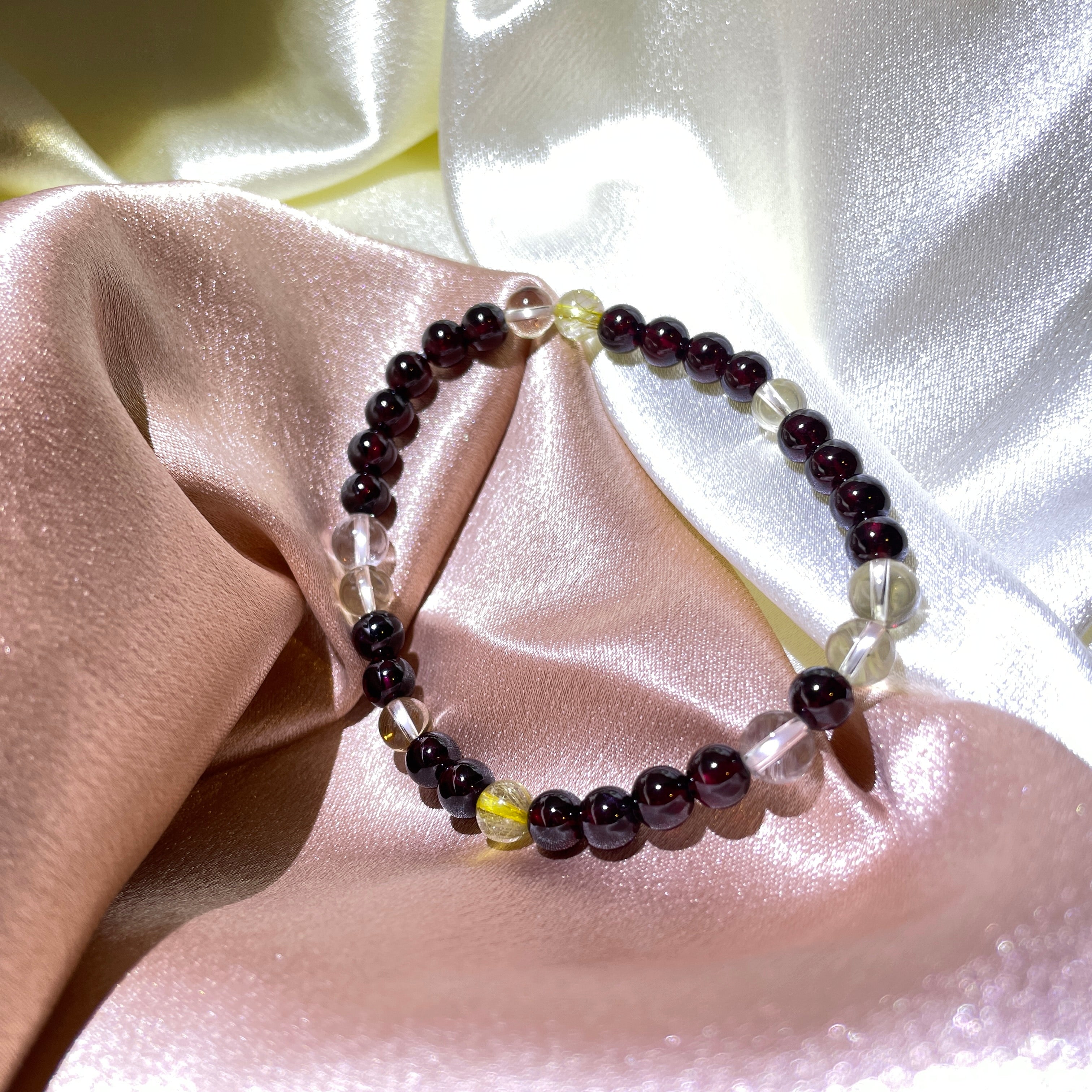 Image of a bracelet with pink and white crystals