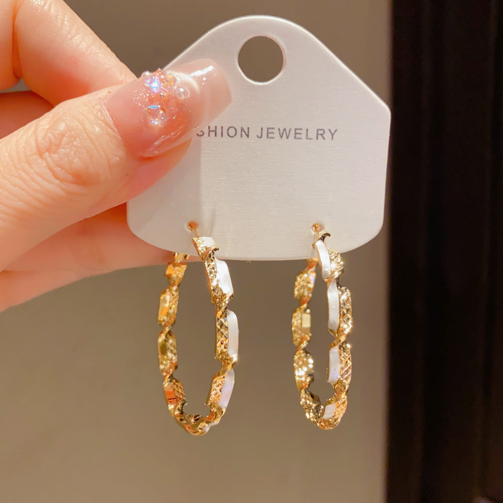 Eaioncol Spliced Twisted Hoop Earrings Gold