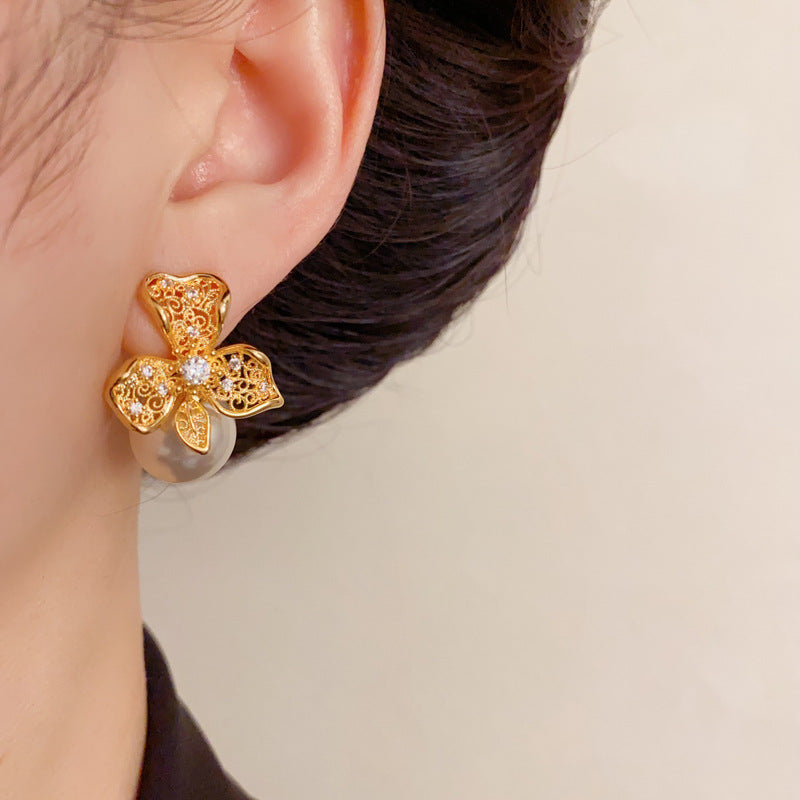 Elegant Hollow Metal Petal Pearl Stud Earrings – Floral Design
