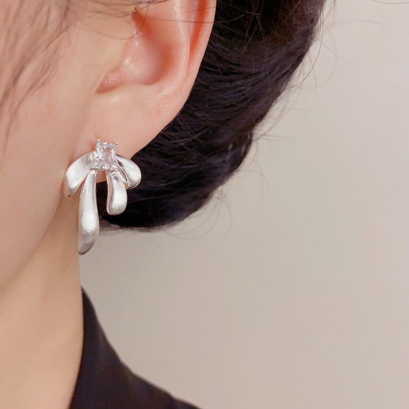 Eaioncol Brushed Metal Bow Stud Earrings Gold Silver