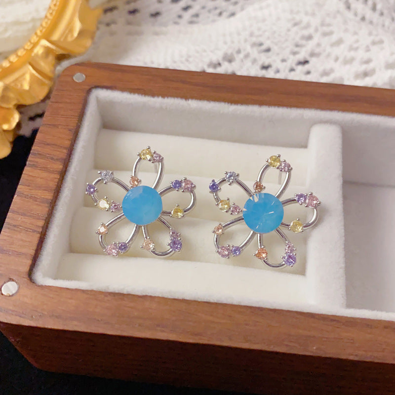 Elegant Rhinestone Hollow Petal Stud Earrings – Floral Design