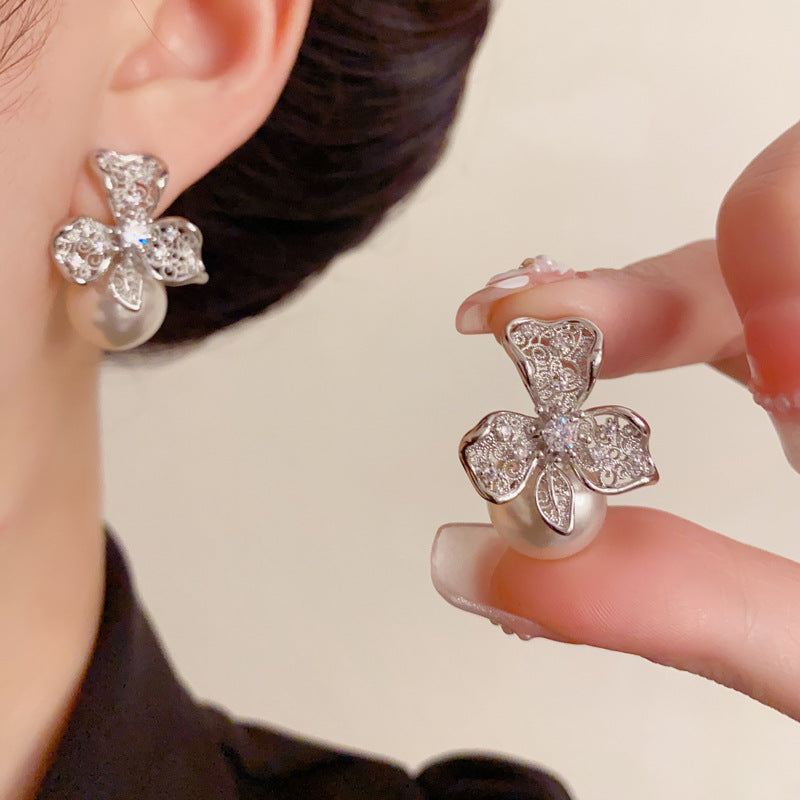 Elegant Hollow Metal Petal Pearl Stud Earrings – Floral Design