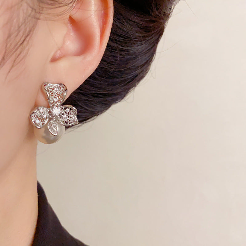 Elegant Hollow Metal Petal Pearl Stud Earrings – Floral Design