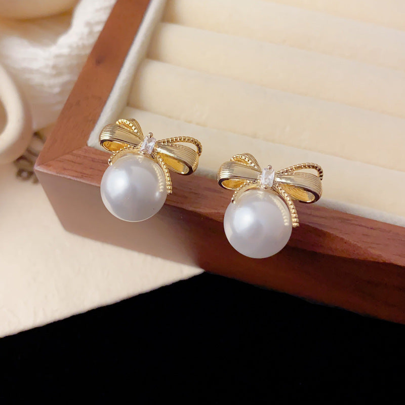 Elegant Metal Bow Pearl Stud Earrings – French Minimalist Design